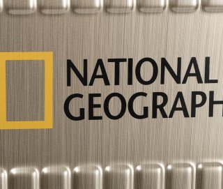 Середня валіза на 4-х колесах 60/70 л National Geographic Transit, золотий