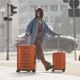 Victorinox Travel AIROX велика валіза з полікарбонату на 98 л помаранчевий